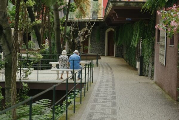 Older couple sitting together in a garden