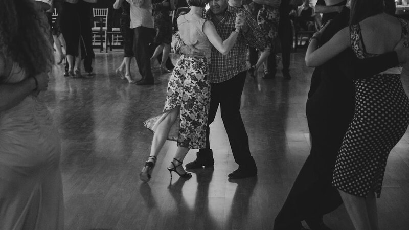 Couples dancing together in a ballroom — social dancing for health after 50