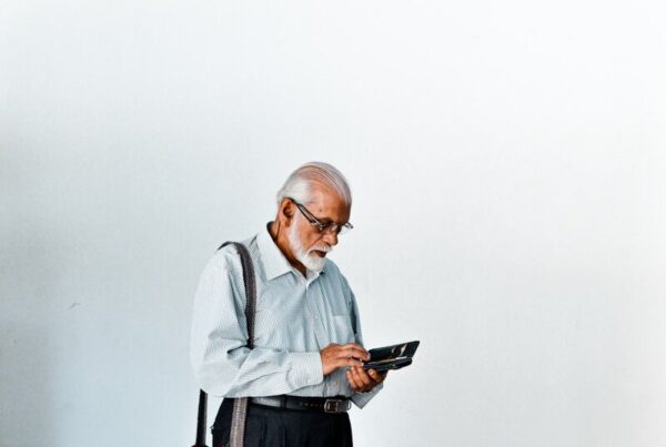 Older adult using a tablet for online banking
