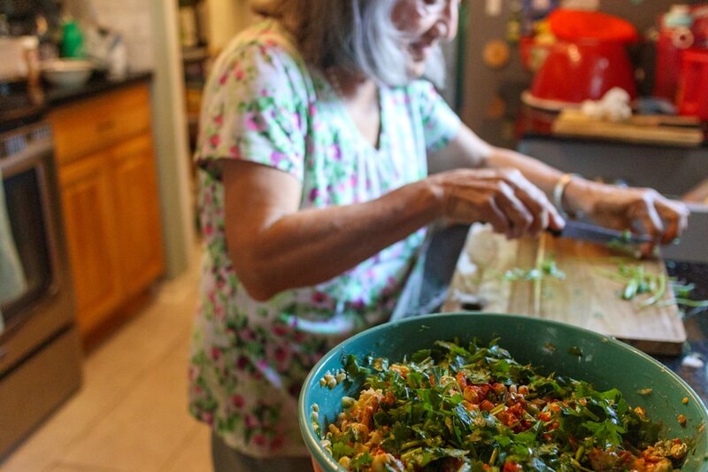 Older adult preparing a healthy meal in the kitchen