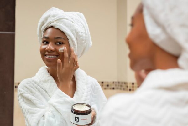 Older adult applying moisturiser for skin care