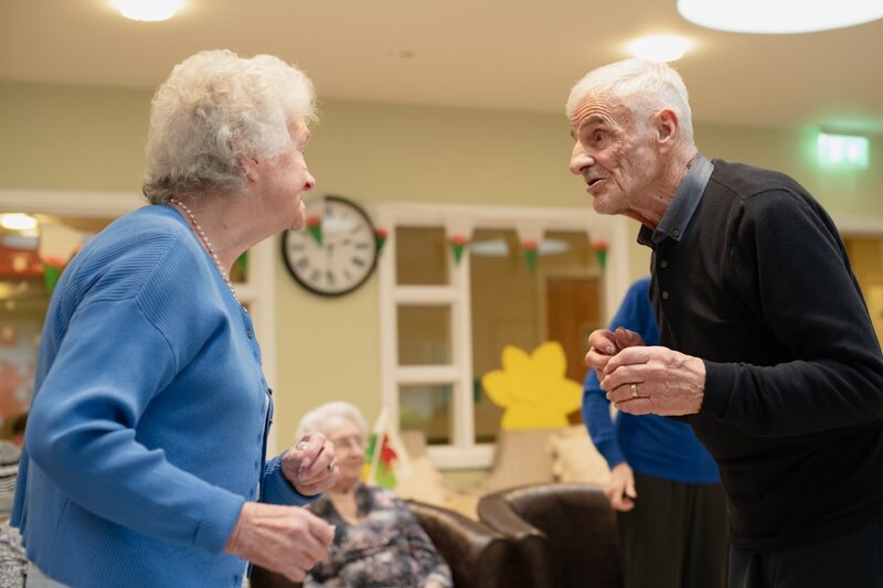 Older couple having a warm conversation about future care plans