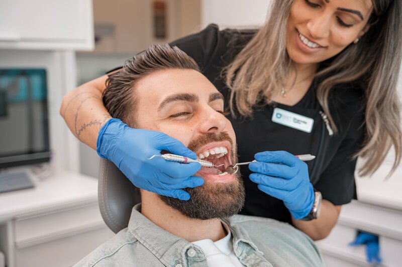Older adult at a dental check-up — regular screening helps detect mouth cancer early