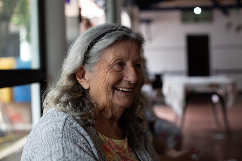 Smiling older adult representing the connection between oral health and overall wellbeing